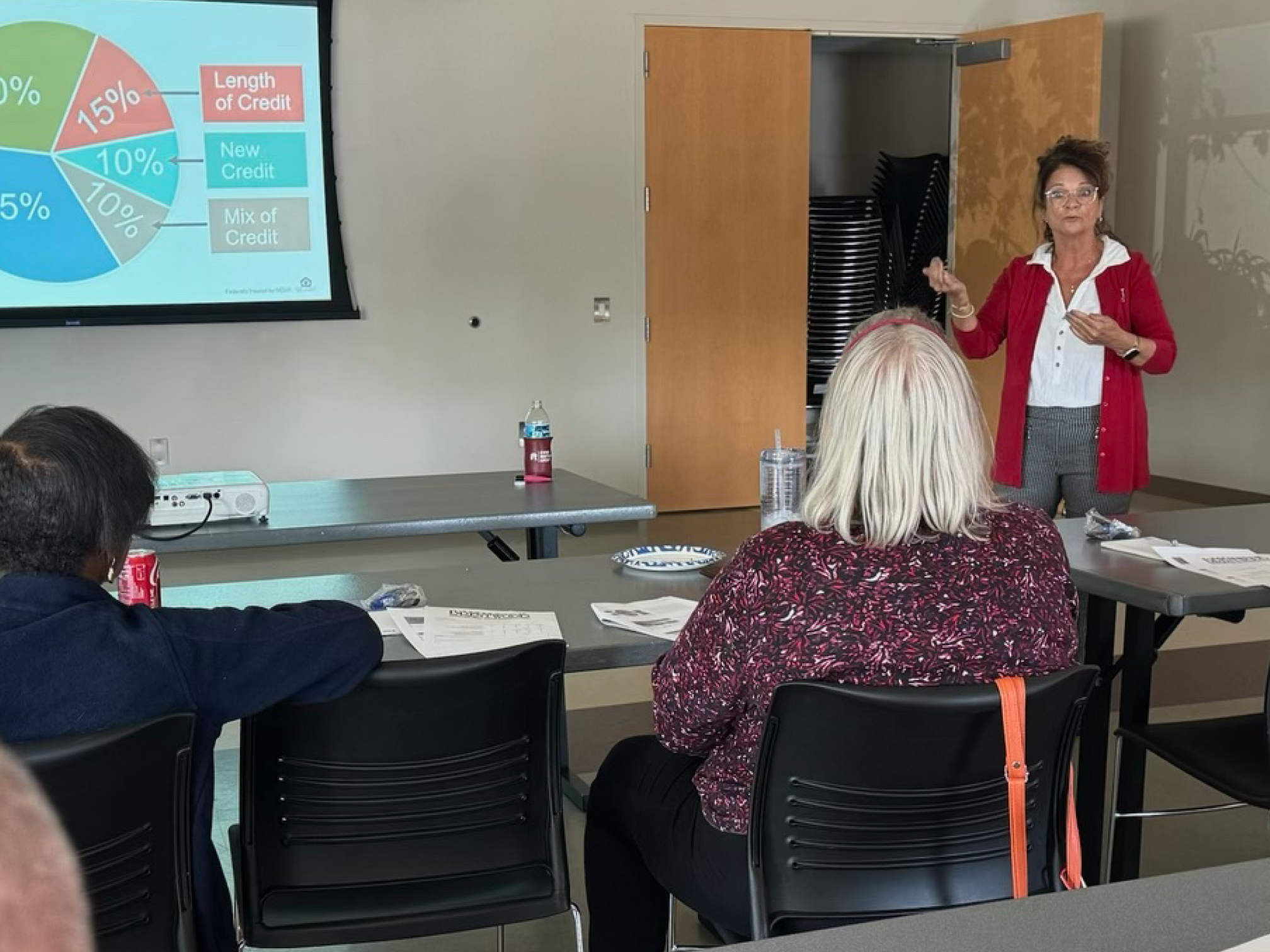 Group of people attending a credit score seminar