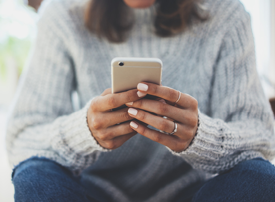 woman looking at phone